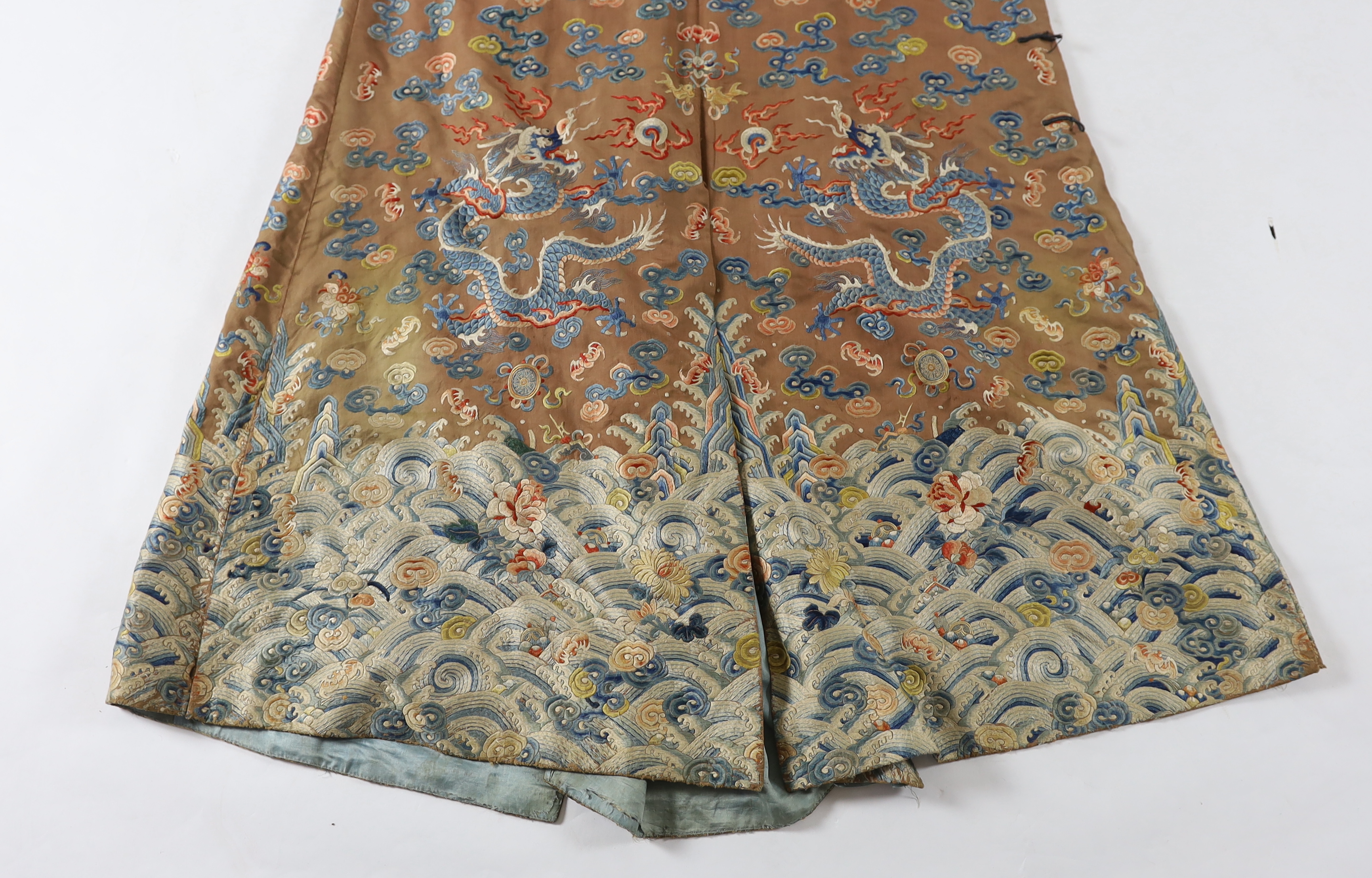 A Chinese chestnut-ground ‘nine dragon’ robe, jifu, 19th century, tears and losses